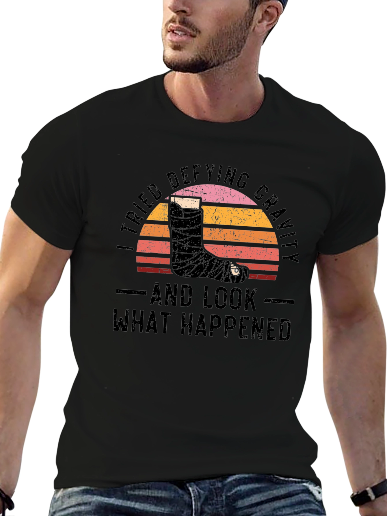 Defying Gravity Graphic Tee - Broken Leg Humor