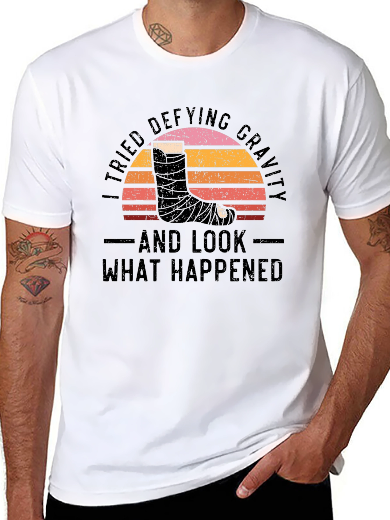 Defying Gravity Graphic Tee - Broken Leg Humor